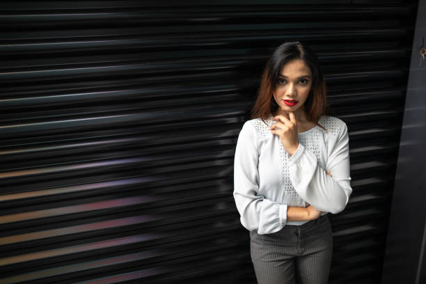 Attractive Malaysian woman with red lipstick, looking at camera, Kuala Lumpur