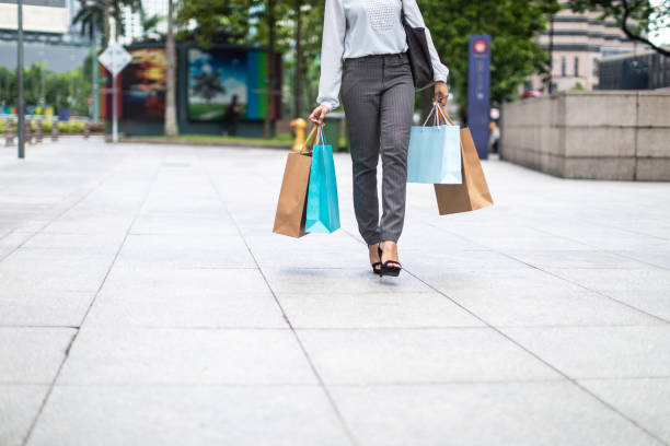 istock Unrecognizable woman carrying paper bags 1124699992