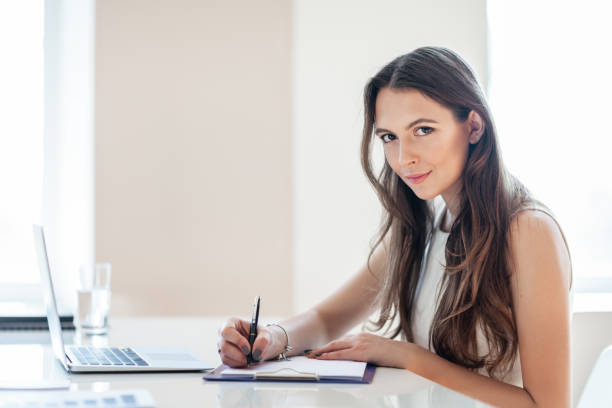 istock B usiness woman working in office with documents 1124700954