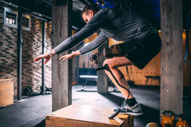 istock Young disabled athlete doing a step-up exercise as a part of his gym training in a gym 1124701720