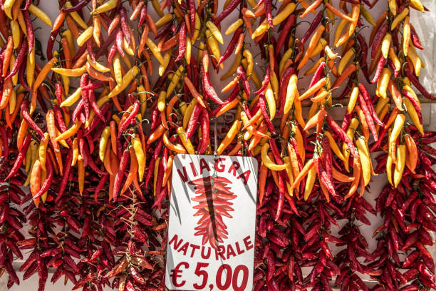 istock chilli peppers hanging from a market stall 1124704697