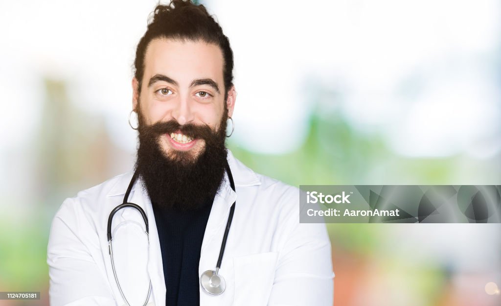 Doctor With Long Hair Wearing Medical Coat And Stethoscope Smiling With  Hands Palms Together Receiving Or Giving Gesture Hold And Protection Stock  Photo - Download Image Now - iStock