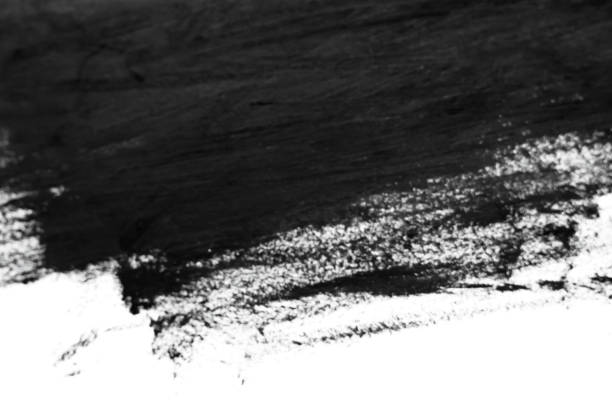 istock Black brush strokes on white paper. Dark abstract watercolor paint texture. 1124709550