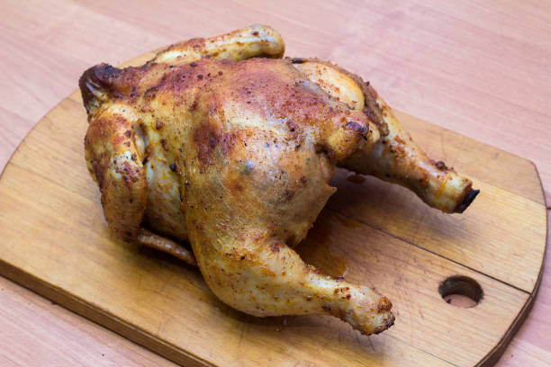 istock whole fried chicken in spices on a wooden tray 1124711480