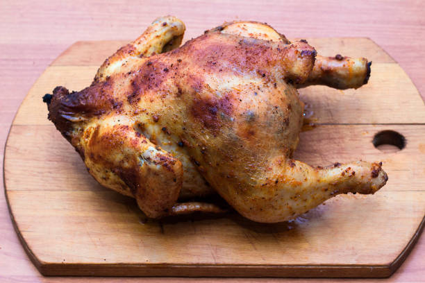 istock whole fried chicken in spices on a wooden tray 1124711485