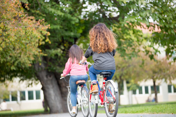 istock University students riding bikes outdoors 1124712580