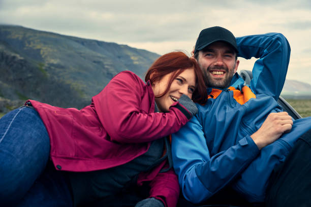 istock Couple enjoying glacier lagoon from car mask 1124713704