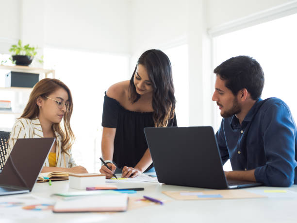 istock Team of millennials working in the office 1124714986