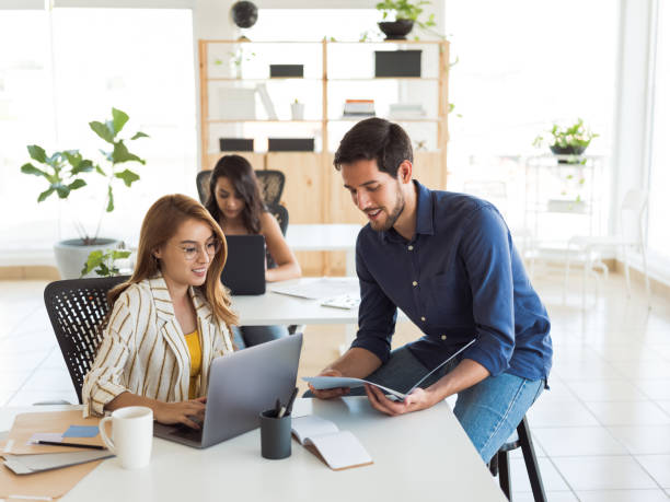 istock Millennial man and woman working together 1124715014