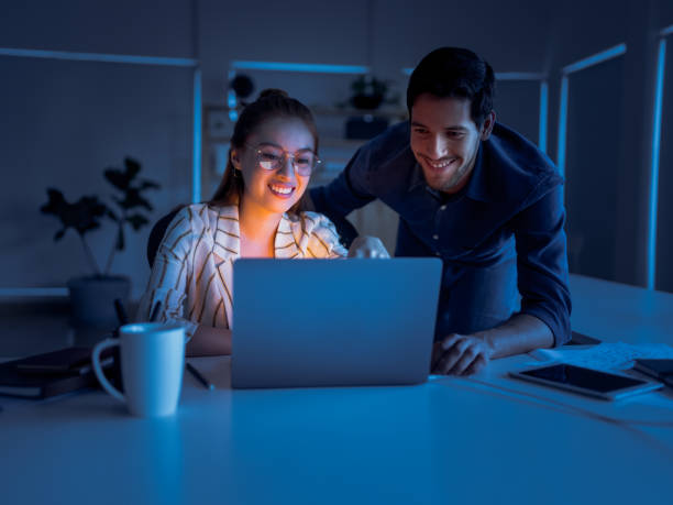 istock Coworkers in the office working late 1124715044