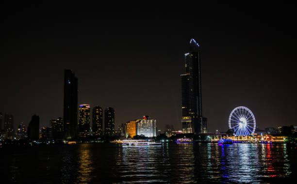 istock Illuminated Buildings In City Against Sky At Night 1124715836