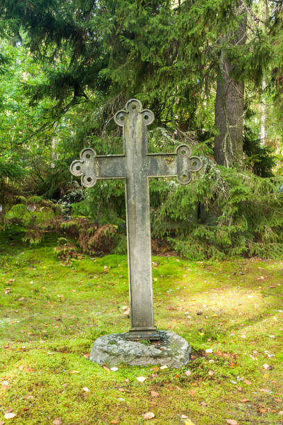 istock Cross at old beautiful semetery in Finland. 1124716889