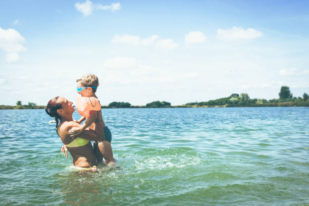 istock Happy mother and son having fun on summer vacation. 1124717214