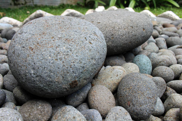 istock Big stones among smaller pebbles, in the garden. 1124717366