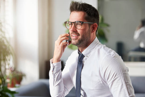 istock Businessman making a call while sitting in the office 1124717465