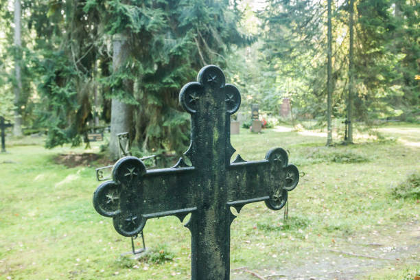 Cross at old beautiful semetery in Finland