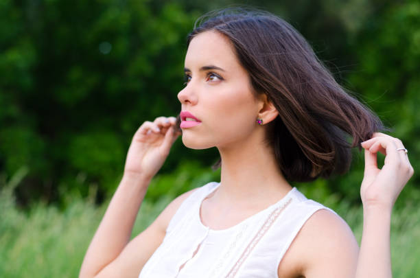 istock Young woman in the summer nature 1124719244