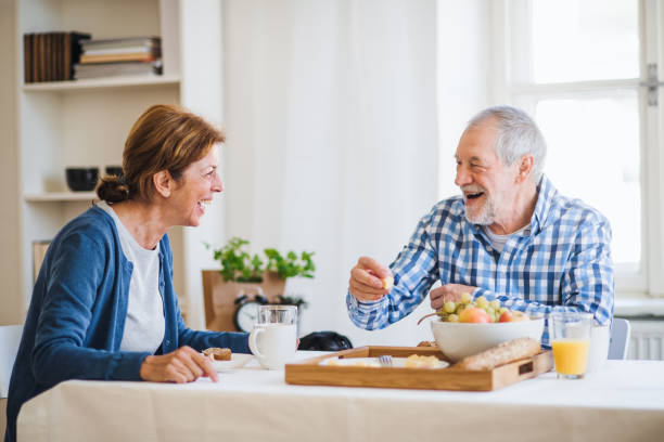 istock A senior couple sitting at the table at home, having breakfast. 1124720125