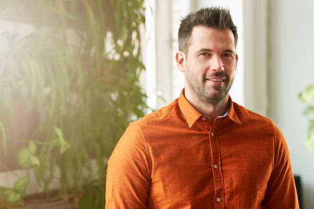 istock Casual man portrait while standind indoor 1124724386