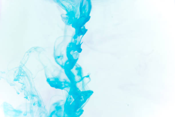 istock a drop of paint pouring in water 1124730853