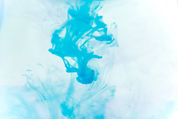 istock a drop of paint pouring in water 1124730866