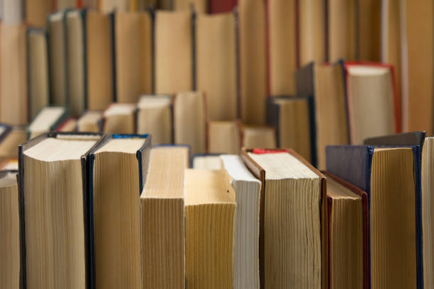 istock Open book, hardback books on wooden table. Back to school. Copy space 1124733479