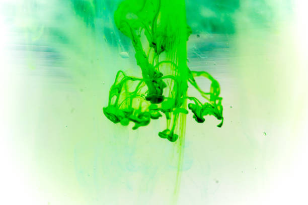 istock a drop of paint pouring in water 1124734396