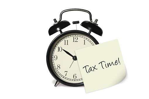 Tax time alarm clock note reminder planning audit isolated