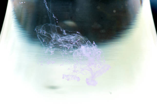 istock a drop of paint pouring in water 1124735978
