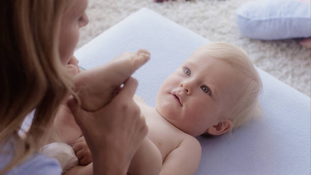 istock Mother playing with her cheering baby 1124736810