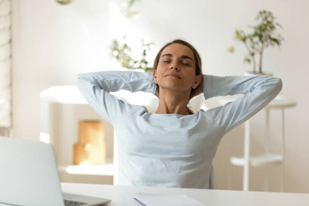 istock Peaceful woman relaxing in comfortable chair leaning back 1124743260