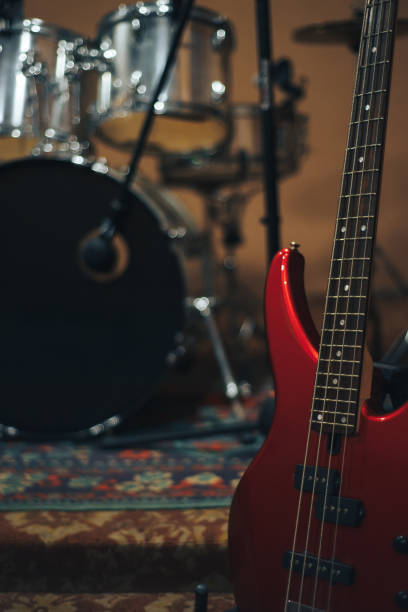 istock Red bass guitar on a home musical studio background. 1124743307