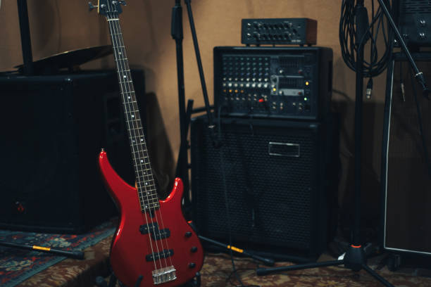 istock Red bass guitar on a home musical studio background. 1124743836
