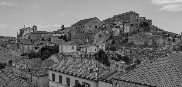A black and white picture of the rooftops of Dubrovnik's old town.