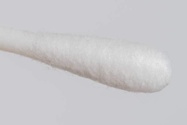 istock Close-up on cotton swab on ear wool stick. 1124747662