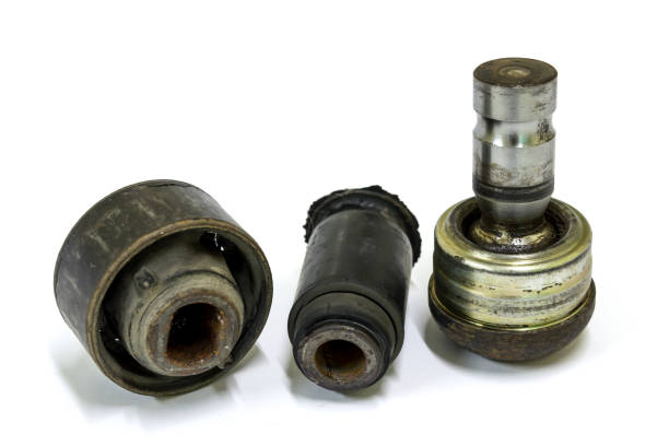 Damage lower arm bushing and ball joint on white background.