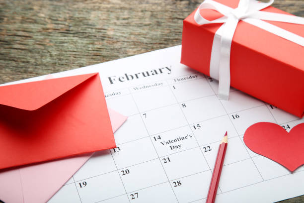 istock Red heart with envelope and gift box on february calendar 1124747845