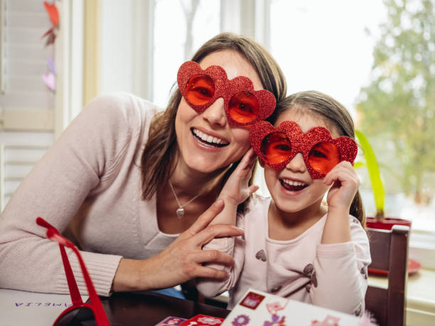 istock Mother and young daughter crafting for Valentine's Day 1124747895