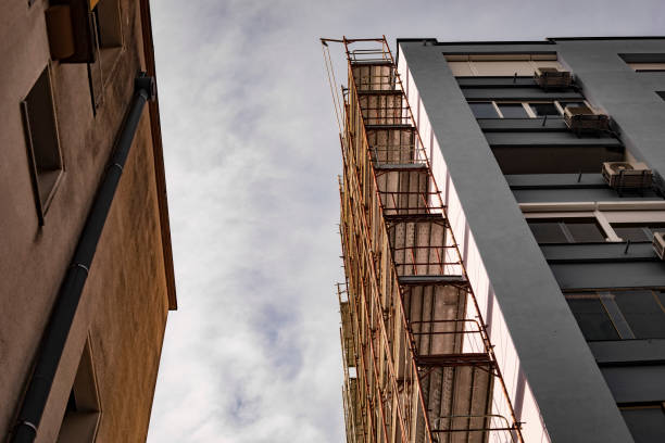 istock Looking up at scaffolding on a building’s exterior while under construction 1124750187