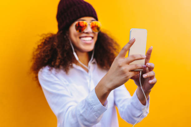 istock African girl taking a selfie 1124752668