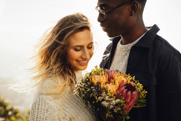 istock Beautiful couple outdoors with flowers 1124753266