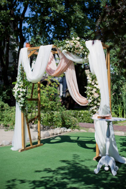 istock Arch for the wedding ceremony, decorated cloth and flowers 1124753451