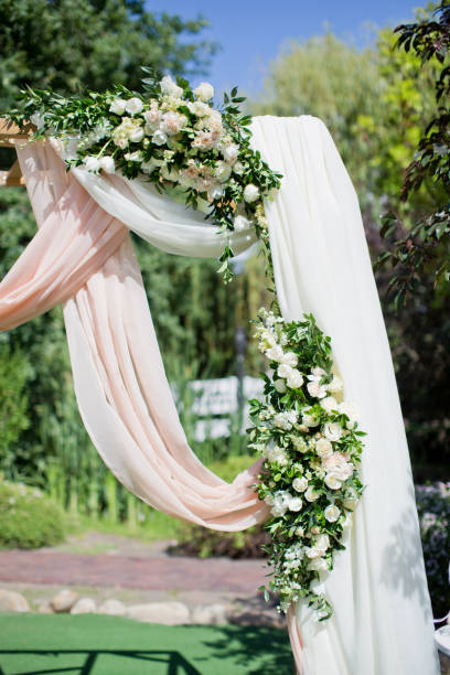 istock Arch for the wedding ceremony, decorated cloth and flowers 1124753467