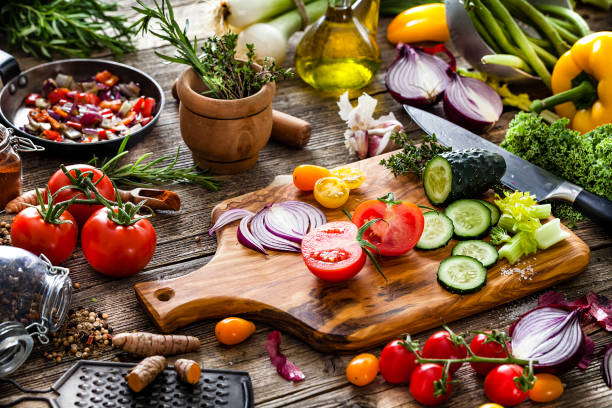 istock Fresh vegetables ready for cooking shot on rustic wooden table 1124754334