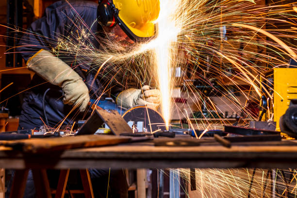 istock Man Grinding Metal In Factory 1124756849