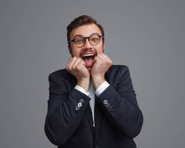 istock Excited businessman screaming and looking at camera 1124757976