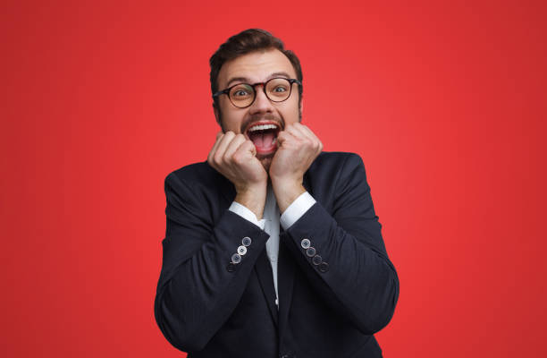Excited businessman gesturing and screaming
