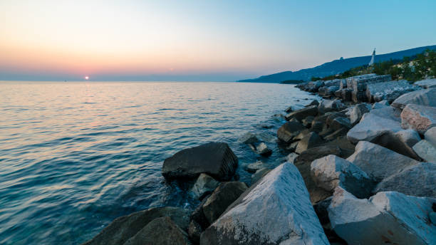 istock Sunset near the old  lighthouse of Trieste 1124759752