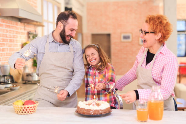 istock Family celebrating birthday at home 1124760245