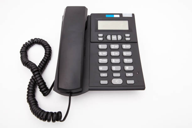 istock Modern black color desk telephone isolated on white background. 1124762445